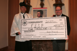 PLMC Treasurer Mr. Tom Oxenreiter presenting Fr. Gregory Pendergraft, FSSP with a $1000 donation from the PLMC Seminary Fund